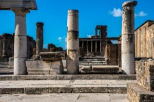 Explore the well-preserved ruins of ancient Pompeii featuring classic stone columns.